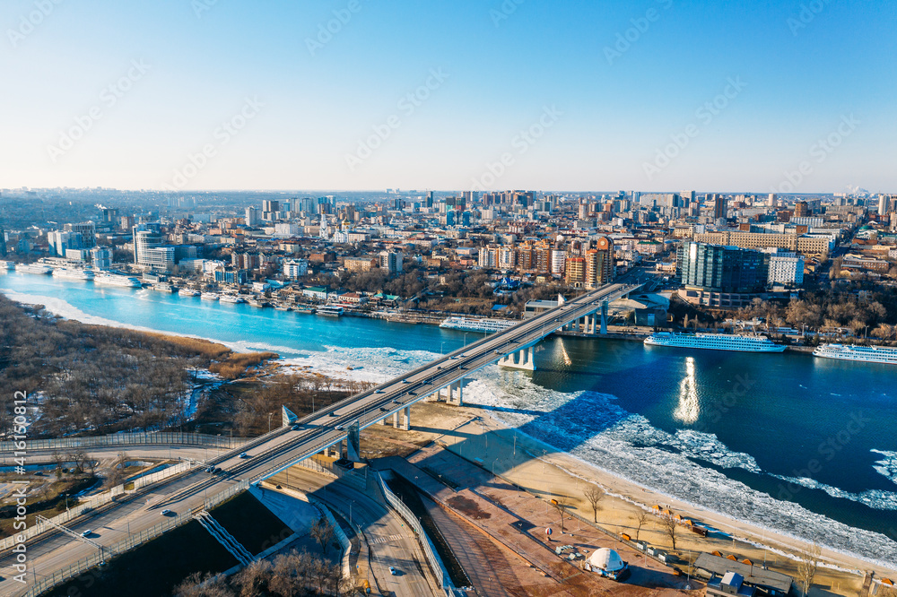 Voroshilovskiy Bridge above Don river and Rostov On Don aerial panoramic view of beautiful winter Russian city. Voroshilovskiy Bridge above Don river and Rostov On Don aerial panoramic view of beautiful winter Russian city.