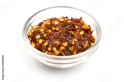 Red pepper flakes, isolated on white background. High resolution image