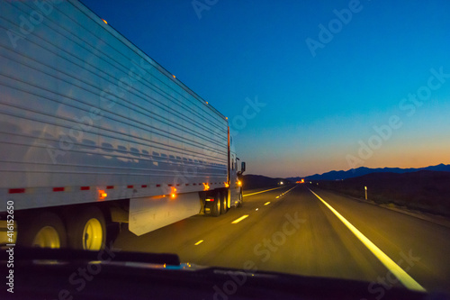 Driving on highway to Las Vegas at dusk, Nevada, USA