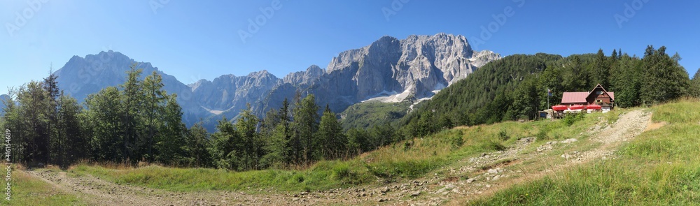 panorama with Jôf di Montasio and Jôf Fuart mountains at Grego brothers Lodge in Julian Alps, Italy