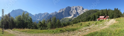 panorama with Jôf di Montasio and Jôf Fuart mountains at Grego brothers Lodge in Julian Alps, Italy