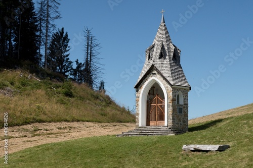 chapel on the northern slope of Mount Jof di Miezegnot in the Julian Alps in Italy photo