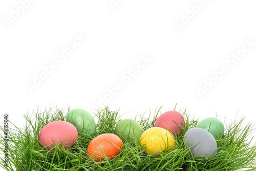 Colorful easter eggs green grass white background