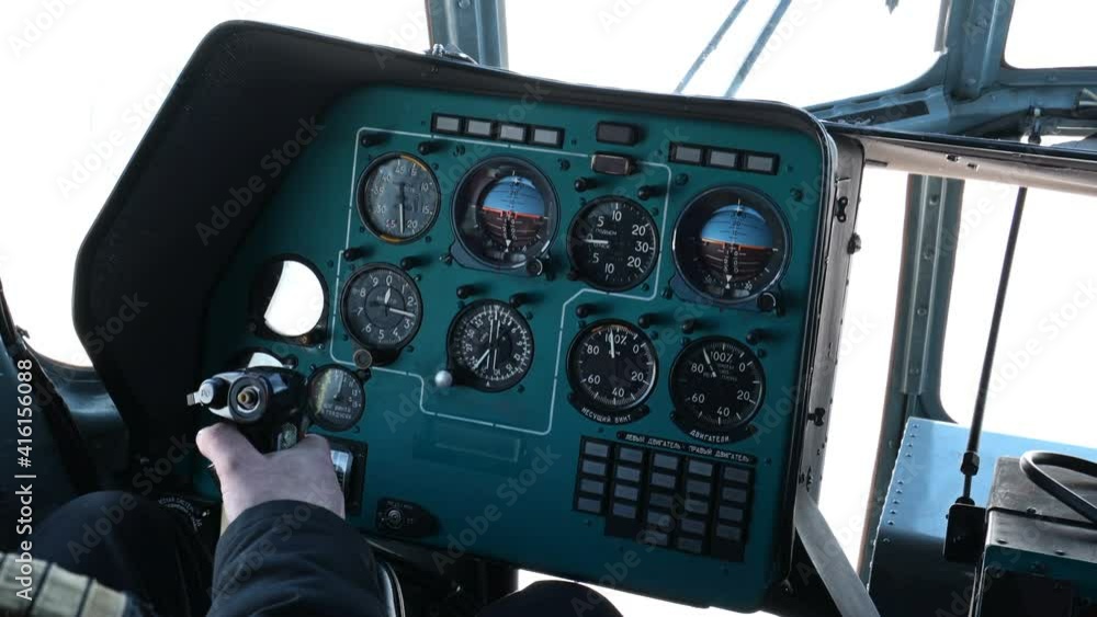 Stockvideon Cockpit of helicopter and the pilot's hand on steering