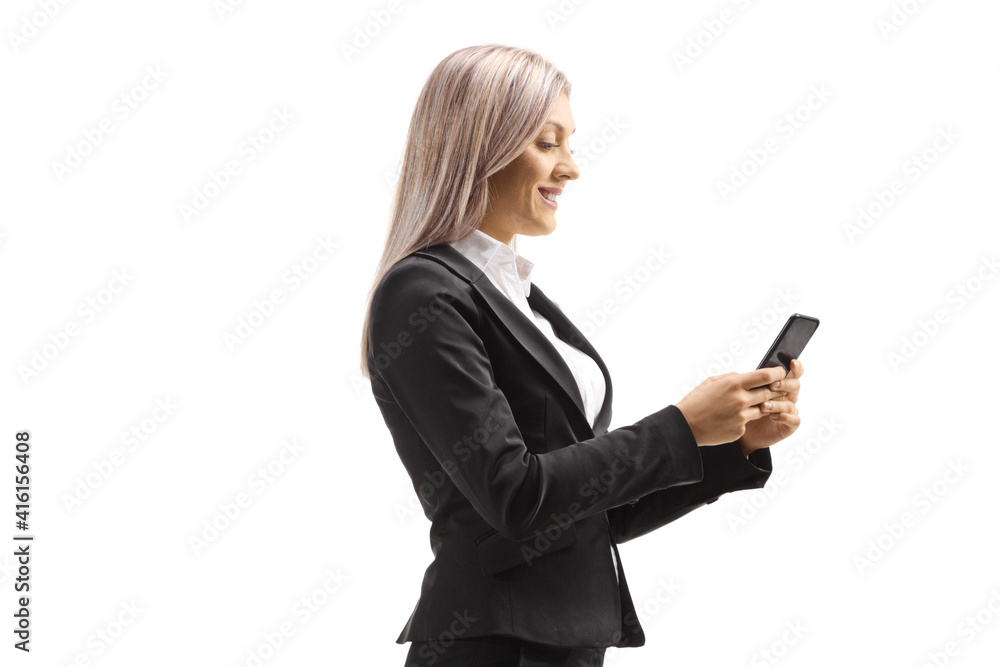 Professional woman smiling and typing on a mobile phone Professional woman smiling and typing on a mobile phone