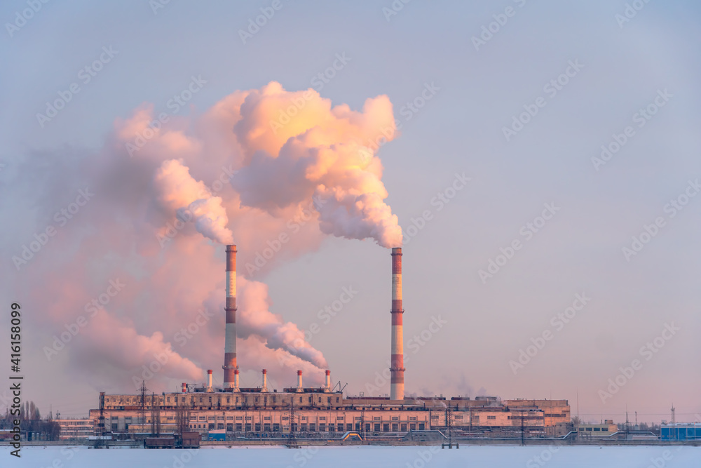 Air pollution by smoke coming out of the factory chimneys in the industrial zone. Industrial plant pipe and Global warming concept and air pollution Air pollution by smoke coming out of the factory chimneys in the industrial zone. Industrial plant pipe and Global warming concept and air pollution