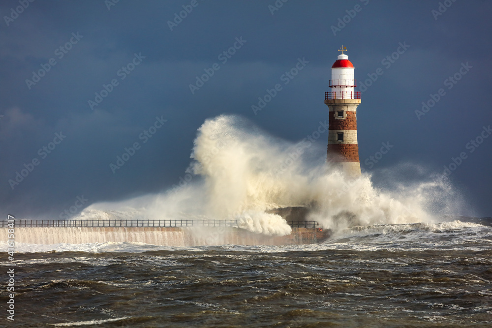 Image of a Lighthouse during a storm at Sunderland, Tyne and Wear, England, UK.