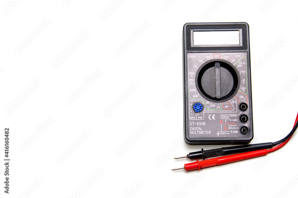Electronic digital multimeter isolated on white with probes. Digital meter with red and black wires. Electronic tester isolated on white background close up Electronic digital multimeter isolated on white with probes. Digital meter with red and black wires. Electronic tester isolated on white background close up