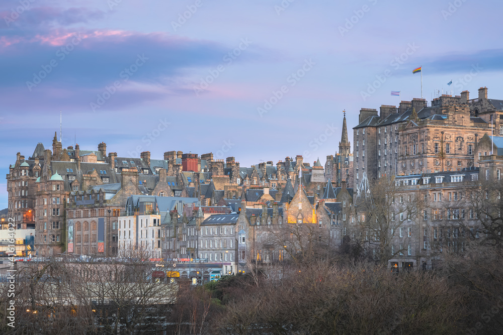 Night cityscape skyline of old town Edinburgh, Scotland with colourful sunset or sunrise sky.
