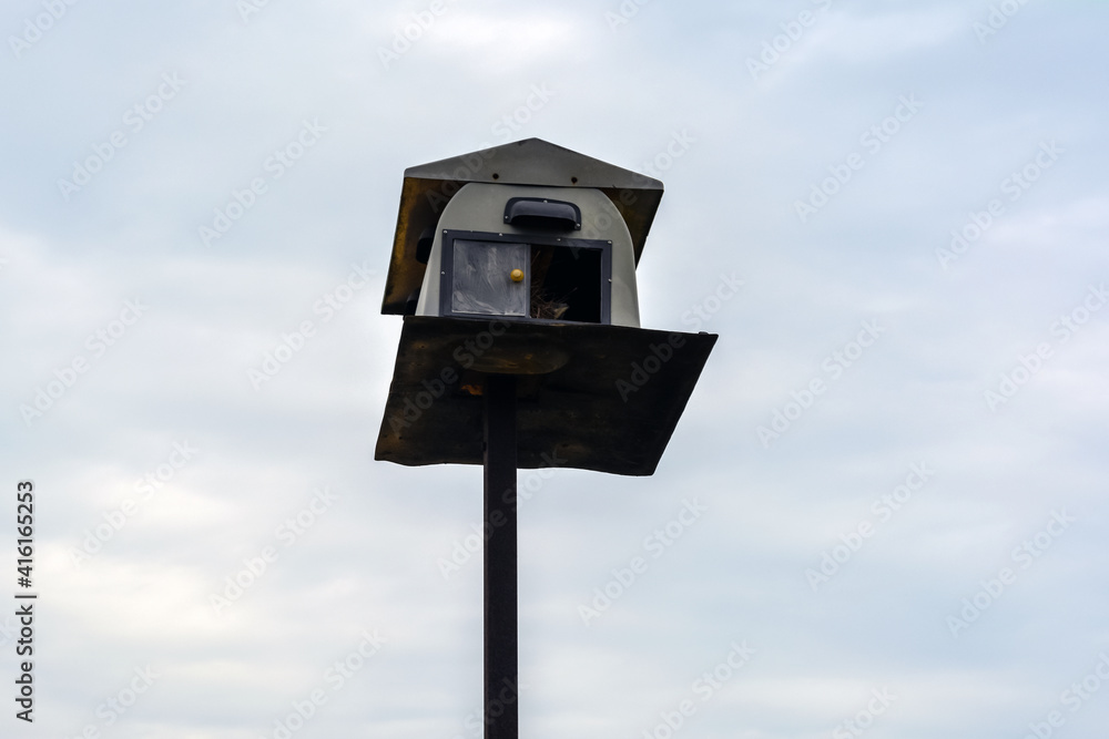 Bird house made from a fiberglass for an owl. Owl is used as pest control in the paddy field.