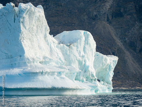Iceberg in the Uummannaq Fjord System. Glaciated Nuussuaq peninsula in the background. Greenland  Denmark.