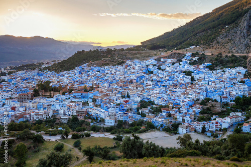 Aerial view of Chefchaouen in Morocco. The city is noted for its buildings in shades of blue and that makes Chefchaouen very attractive to visitors. © Renar