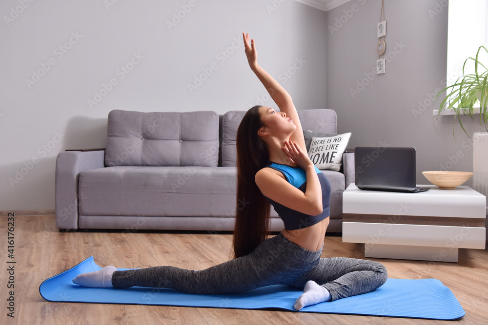 Young asian woman making online training yoga