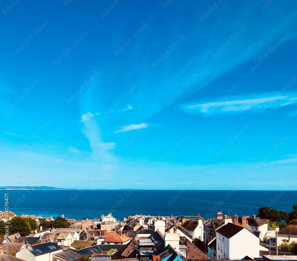 Beautiful View over Houses and Rooftops Across Ocean to the Horizon at Lyme Regis, Dorset