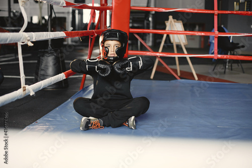 Young hardworking boxer learning to box. Child at sport center. Kid taking up a new hobby