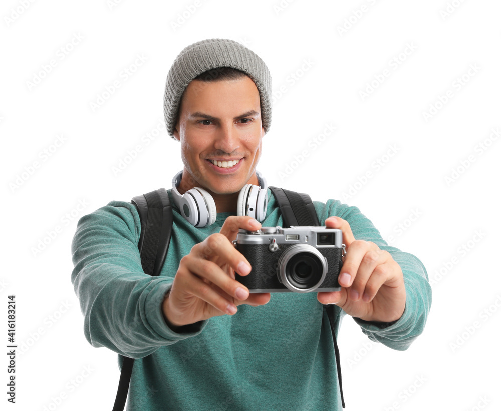 Man with backpack taking picture on white background. Autumn travel Man with backpack taking picture on white background. Autumn travel