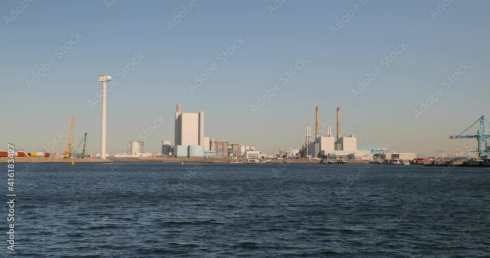 Power plants and other industrial structures at Maasvlakte, in the Port of Rotterdam, The Netherlands, South Holland Power plants and other industrial structures at Maasvlakte, in the Port of Rotterdam, The Netherlands, South Holland
