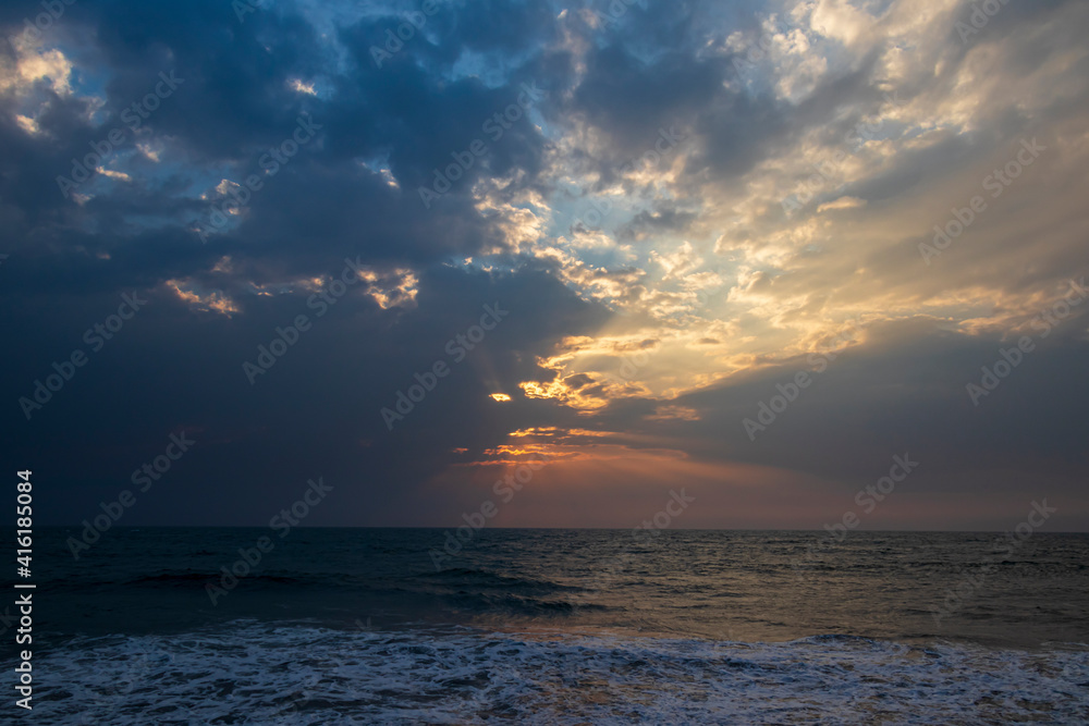 sunset over the sea with god rays