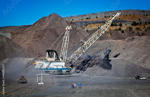 Walking Dragline, Draglines are enormous mobile excavating machines used in open-cut mining to move large quantities of overburden exposing the coal seam. All logos removed. photo