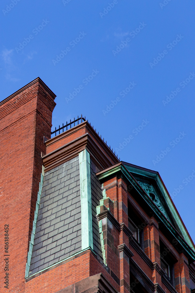 Brick building corner with blue sky background Brick building corner with blue sky background