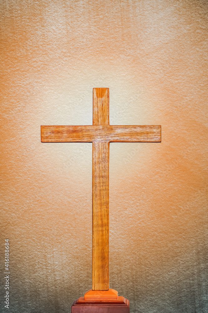 background of wooden cross on bright light flare background