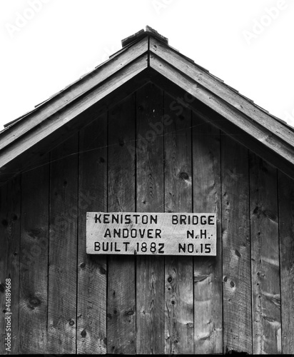 roof peak of a covered bridge in black and white