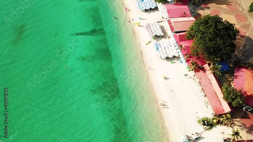 Aerial view of the sunsets over sea. Beautiful blue sea and large calm waves float on the Pacific Ocean. Ocean and sky background landscape