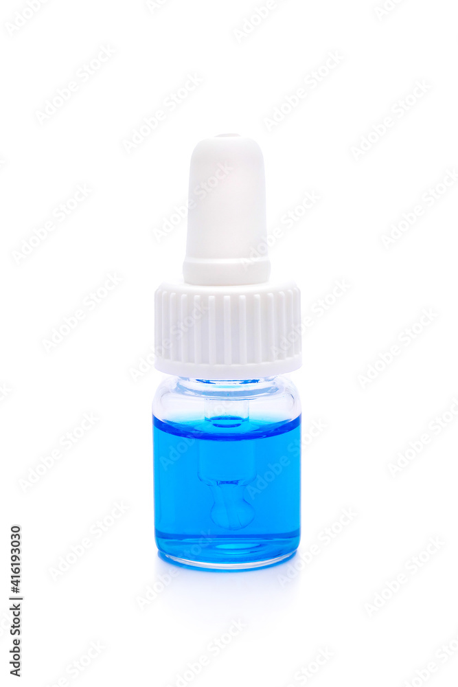 glass bottle with pipette with blue liquid on white background glass bottle with pipette with blue liquid on white background