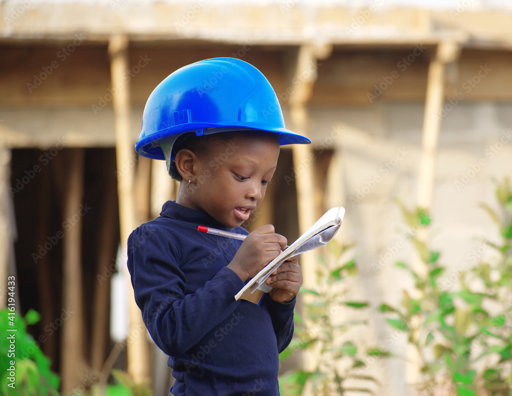 A little African Nigerian girl acting the role of a construction