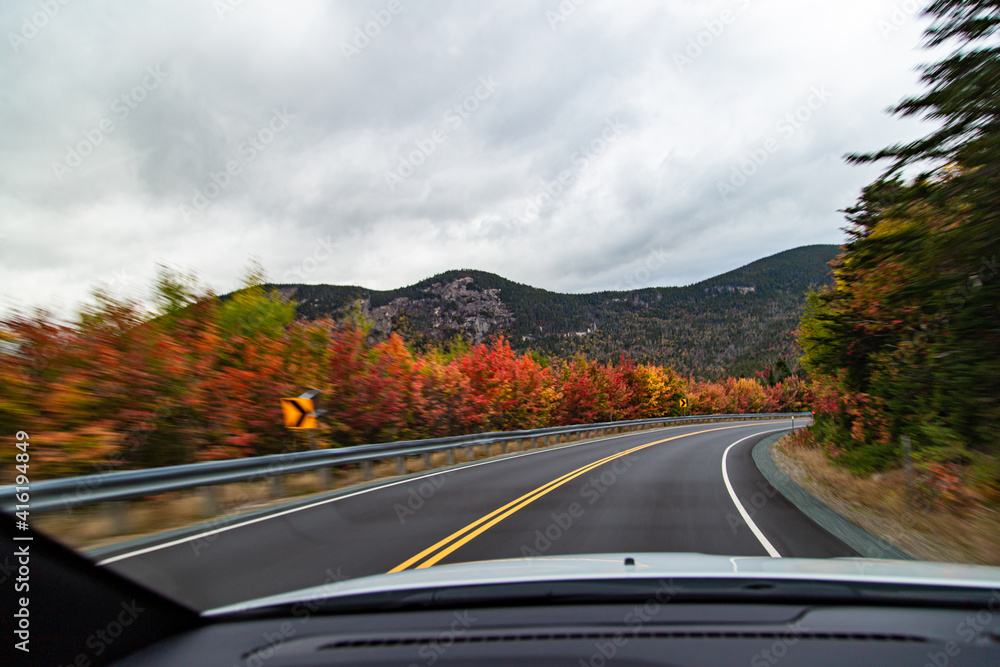 driving on a road in autumn driving on a road in autumn