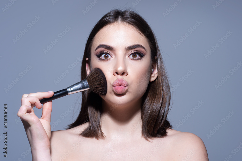Cute girl with makeup and blusher brush. Cosmetics product concept. Cute girl with makeup and blusher brush. Cosmetics product concept.