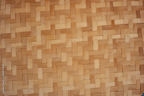 Indonesian traditional woven texture made of bamboo skin. beautiful pattern Javanese handmade kitchen tools. details of the food container and rice filter