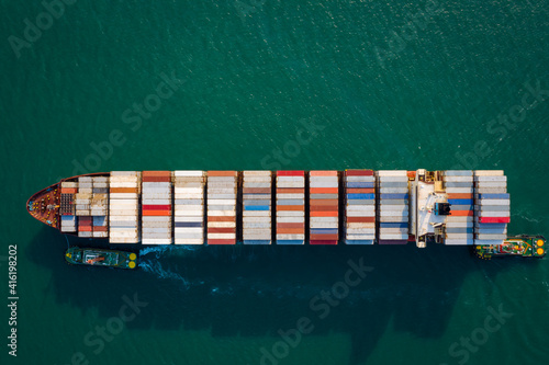 Aerial top view from drone, Container ship sailing on the green sea