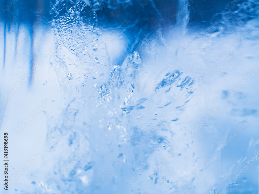Ice texture. Blue color. Close up macro shot. Soft focus. Blurred background.