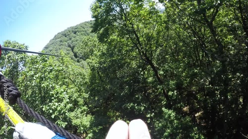 POV Person Zip-Lining in Tall Trees in Forest in Amicalola Falll State Park photo