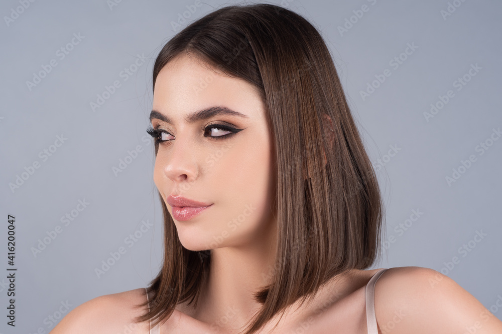 Evening makeup woman. Beautiful make-up with black smokey eyes. Closeup of sexy woman face. Evening makeup woman. Beautiful make-up with black smokey eyes. Closeup of sexy woman face.