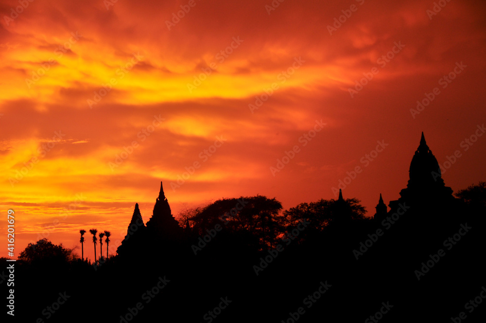 View landscape with silhouette chedi stupa of Bagan or Pagan ancient city and UNESCO World Heritage Site with over 2000 pagodas and temples evening twilight dusk time in Mandalay Region of Myanmar