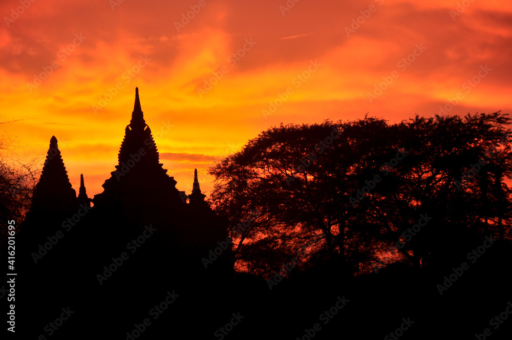 View landscape with silhouette chedi stupa of Bagan or Pagan ancient city and UNESCO World Heritage Site with over 2000 pagodas and temples evening twilight dusk time in Mandalay Region of Myanmar