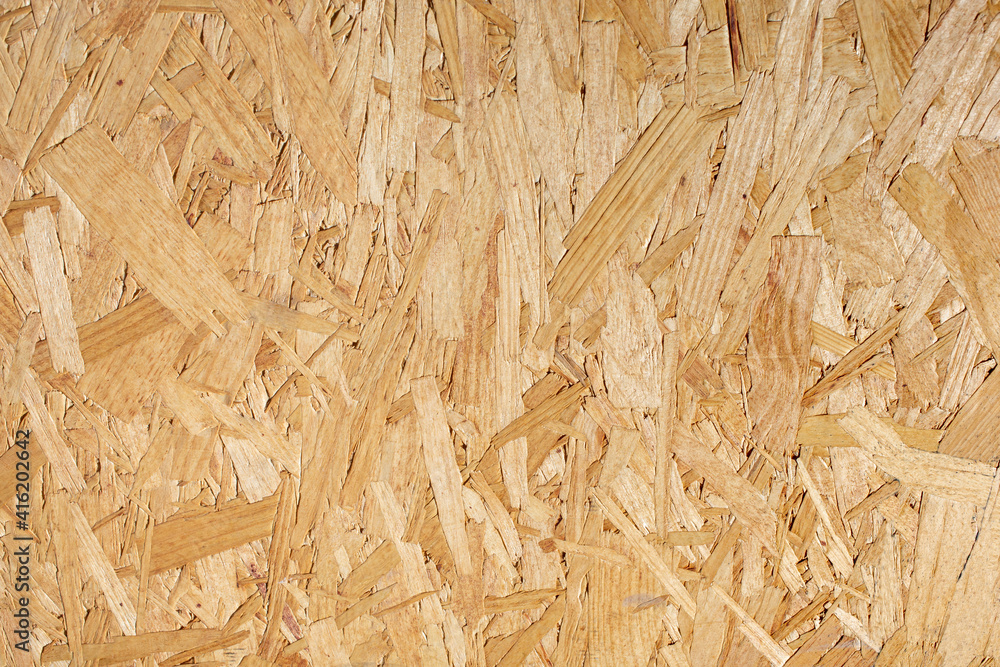 A view of a background of oriented strand board. A view of a background of oriented strand board.