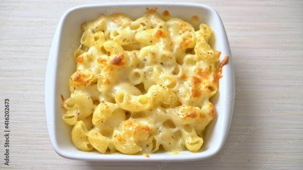 mac and cheese, macaroni pasta in cheesy sauce - American style mac and cheese, macaroni pasta in cheesy sauce - American style