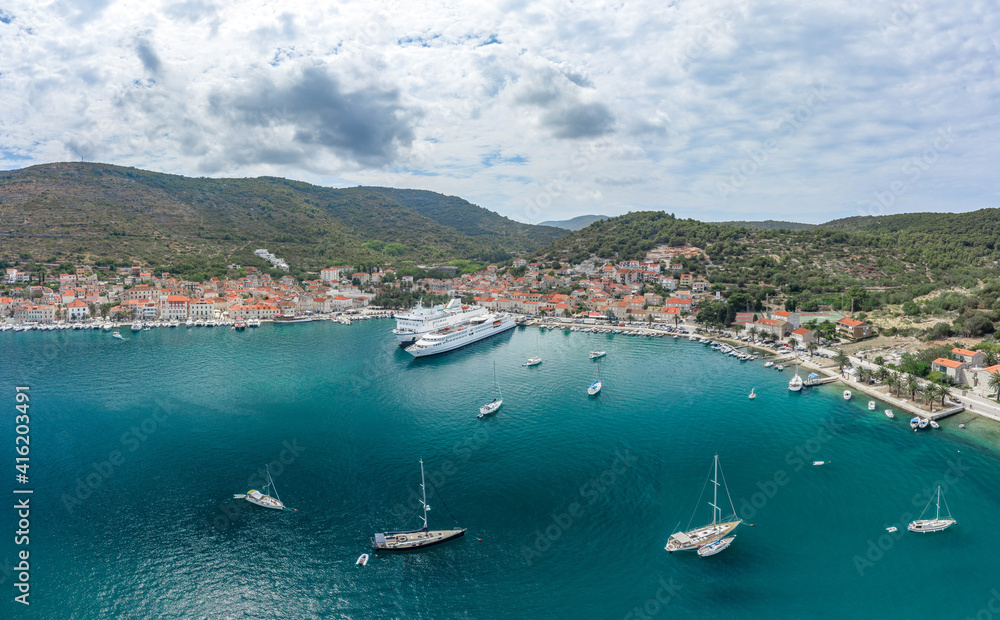 Aerial drone shot of cruise ferry at Adriatic sea port on Vis Island in Croatia summer Aerial drone shot of cruise ferry at Adriatic sea port on Vis Island in Croatia summer
