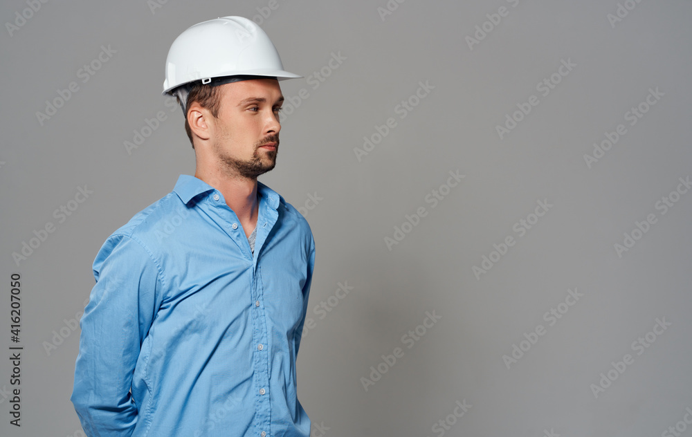 A business man with a helmet on his head Builder architect A business man with a helmet on his head Builder architect