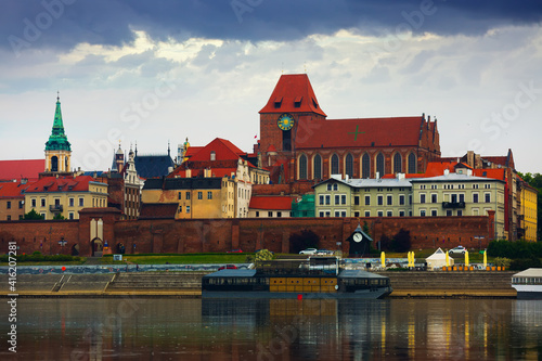 View of Torun city with Catholic church of Saints John Baptist and John Evangelist across Vistula in springtime, Poland