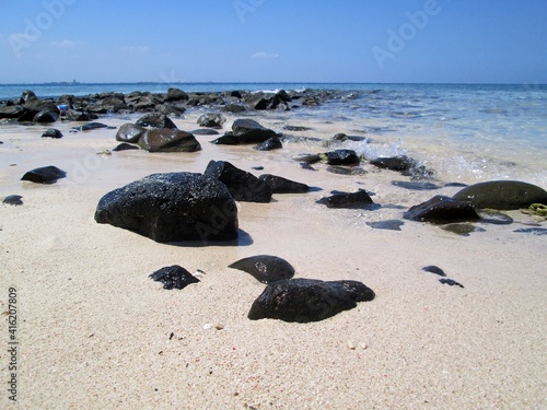 The unraveled rocks in the Samalona beach photo