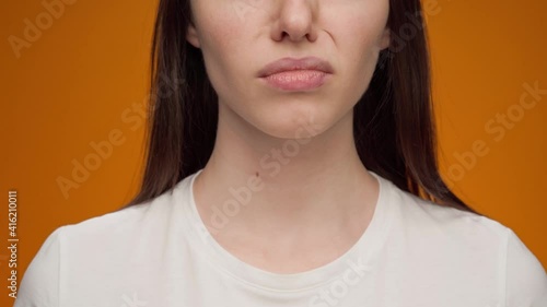 Close up of a woman closing nose bacause of a bad smell photo