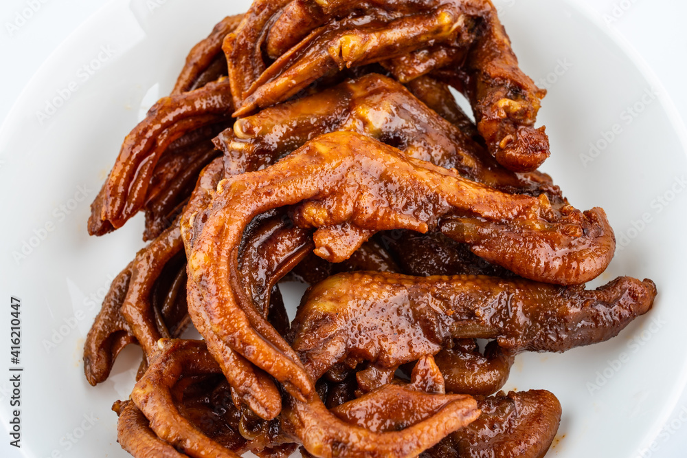 A plate of delicious snack braised duck feet A plate of delicious snack braised duck feet