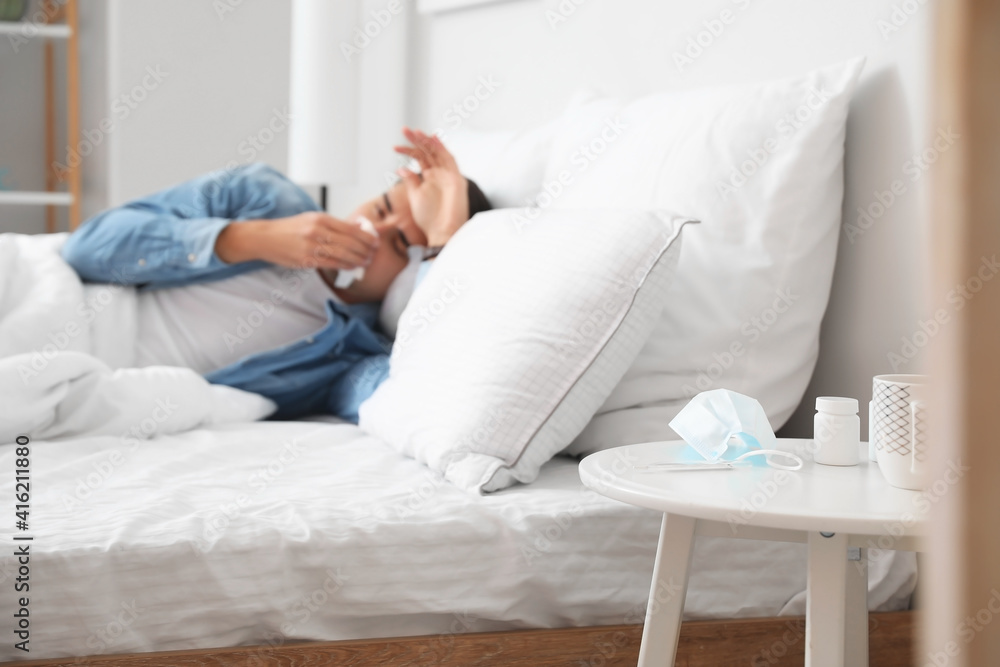 Sick man in bed at home Sick man in bed at home