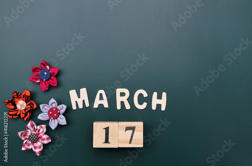 Day 17 of March month, Wooden calendar with date. Empty space for text.
