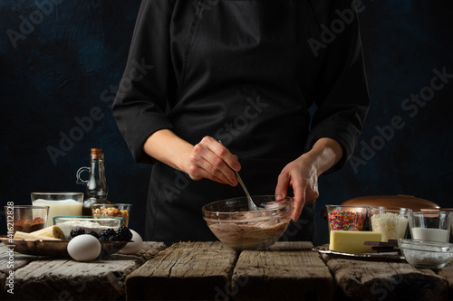 Chef preparing chocolate dough for baking, culinary recipes, making sweets, recipe book and cooking