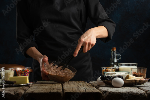 Chef preparing chocolate dough for baking, culinary recipes, making sweets, recipe book and cooking